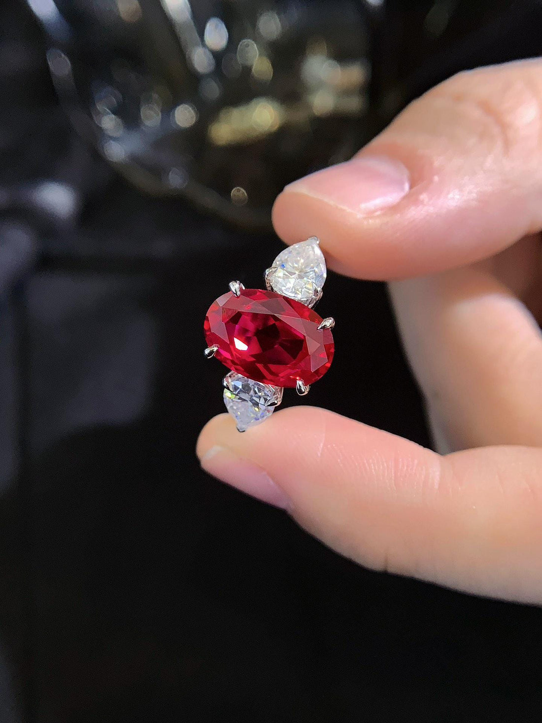 The Red Centerpiece — Oval Ruby with Pear Diamond Accents · 14K White Gold