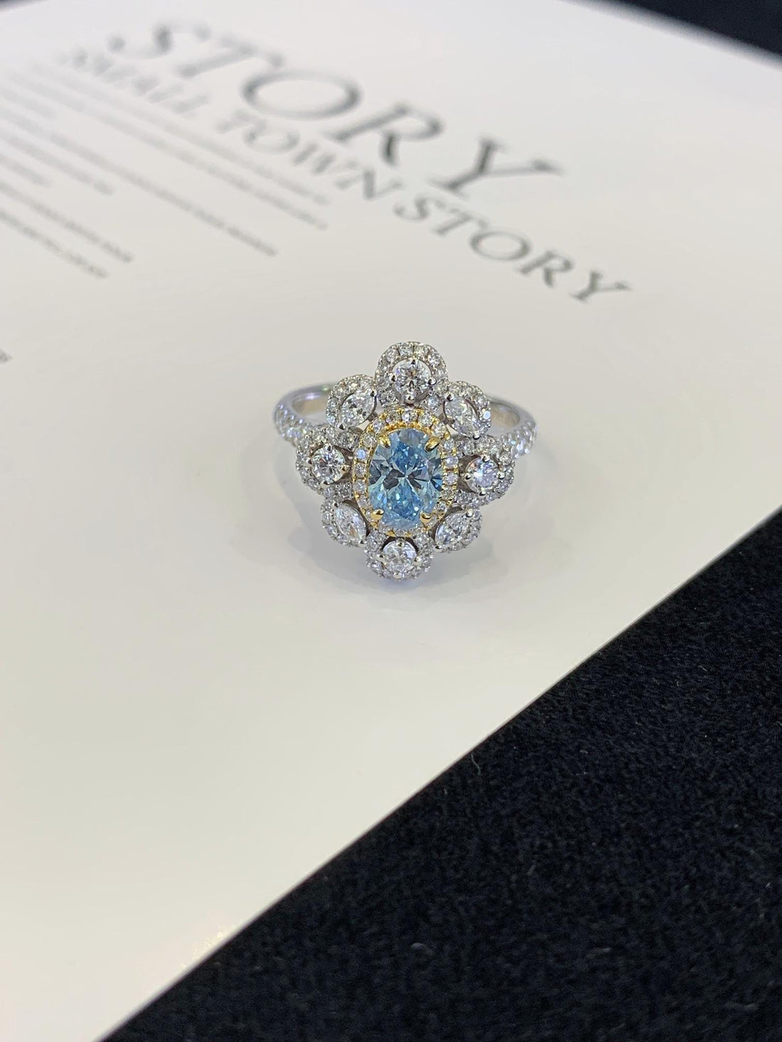 Something Blue, Something Brilliant — Oval Blue Stone Floral Halo Ring