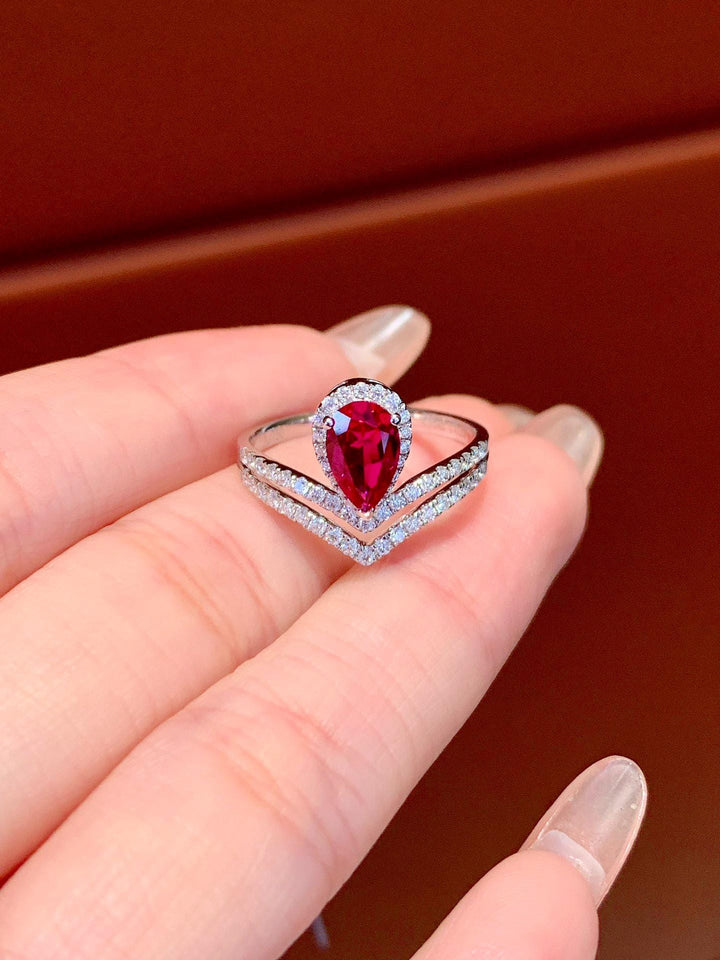 Bold Red, Cold White — Oval Ruby Ring with Diamond Wrap · 14K White Gold