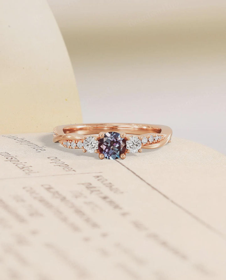 The Stone That Changes With Her — Alexandrite Three Stone Ring · 14K Rose Gold
