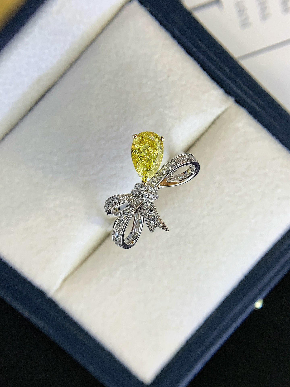 Tied with a Diamond — Yellow Pear Diamond Bow Ring · White Gold