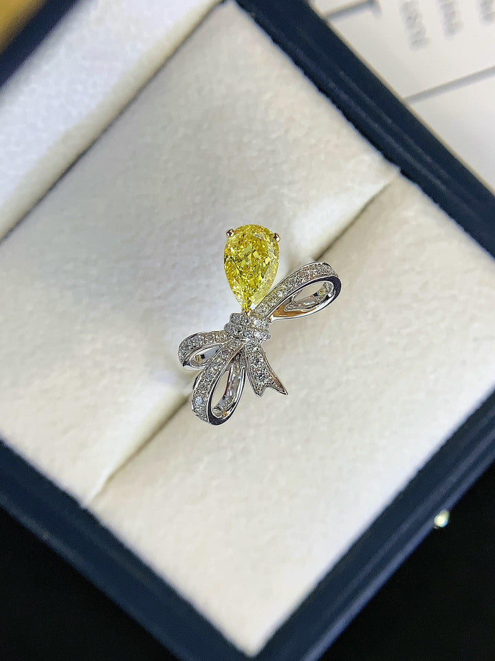 Tied with a Diamond — Yellow Pear Diamond Bow Ring · White Gold