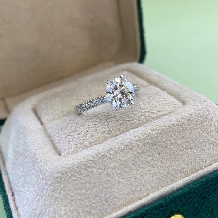 The Solitaire Plus — Diamond Ring · White Gold Solitaire with Pavé Band