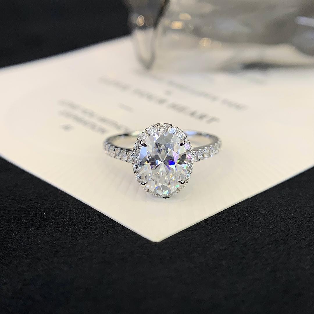 The One They'll All Ask About — Oval Halo Ring · 14K White Gold Pavé