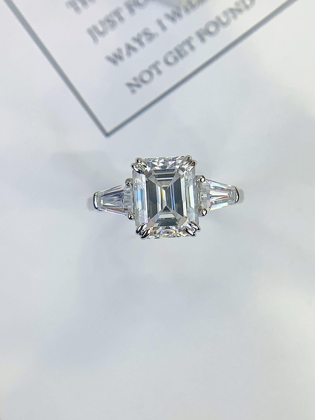 Architectural Elegance — Emerald Cut Ring with Trapezoid Side Stones · White Gold